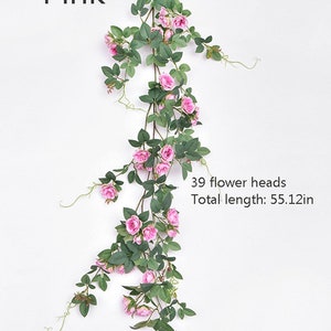 Puede incluir: Una vid artificial de rosas rosas con 39 cabezas de flores y una longitud total de 140 cm.