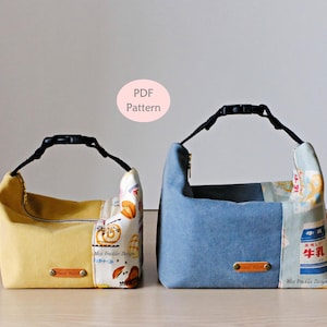 May include: Two fabric pouches with black adjustable buckle handles. The left pouch is yellow with a patterned side panel. The right pouch is blue with a patterned side panel featuring milk carton graphics. Both have small brown labels and text PDF Pattern.