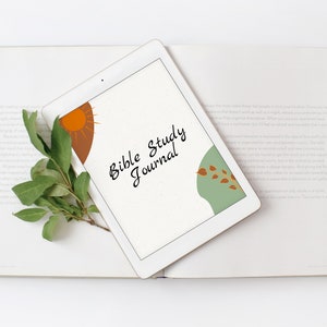 May include: A white tablet with a digital Bible study journal on the screen. The screen has a brown, orange, and green design with a sun and leaves.