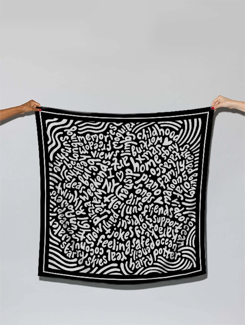 May include: Black and white patterned square scarf with white text on a black background. The text includes words like "memories", "childhood", "home", "family", "friends", "jokes", "safe", "ocean", "Harry Potter", and "NYC".