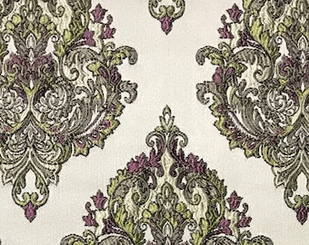 May include: A beige fabric with a repeating pattern of large, intricate damask designs in shades of green and purple.