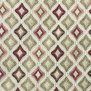 May include: A fabric with a repeating pattern of diamond shapes in shades of red, orange, green, and white.