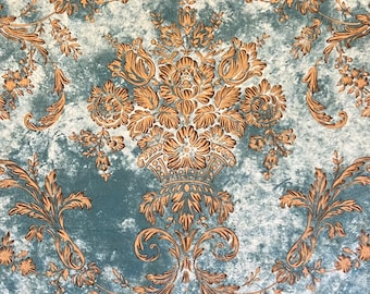 May include: A vintage wallpaper design with a blue background and a gold floral pattern. The pattern features a large, ornate floral motif in the center, surrounded by smaller floral designs.