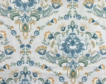 May include: A repeating floral pattern in shades of blue, green, and gold on a light gray background. The design features large, stylized flowers and paisley-like elements, creating a classic, elegant look. Ideal for fabric or wallpaper.