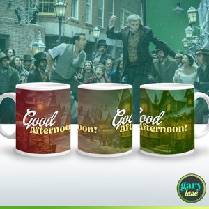 May include: Three white ceramic mugs with a colorful image of a street scene and the text "Good Afternoon!" printed on them. The mugs are arranged in a row from left to right.