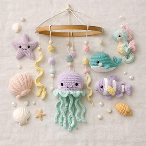 May include: A handcrafted crochet baby mobile with a marine theme. It features a starfish, jellyfish, whale, seahorse, and fish in pastel shades. Wooden beads and a wooden hoop form the mobile's structure. Shells and pearls are arranged around the mobile.