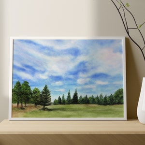 May include: A framed watercolor painting depicting a forest scene with a row of pine trees in the foreground and a blue sky with white clouds in the background.