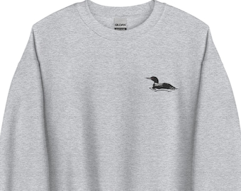 May include: A heather grey sweatshirt with a black embroidered loon on the left chest.