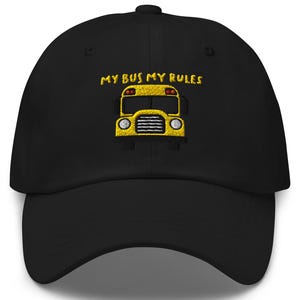 May include: Black baseball cap with yellow embroidered text that reads "My Bus My Rules" and a yellow school bus graphic.