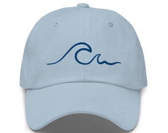 May include: A light blue baseball cap with a blue embroidered wave design.