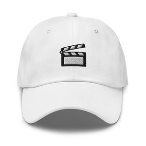 May include: White baseball cap with a black and white embroidered clapperboard design.