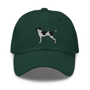 May include: A dark green baseball cap with an embroidered black and white dog on the front.