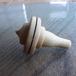spinning top made of robinia wood