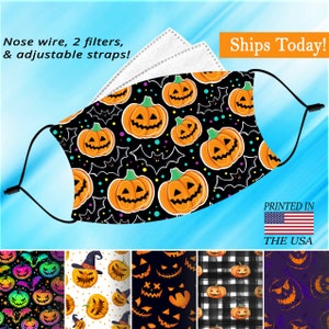 May include: A black face mask with a repeating pattern of orange jack-o'-lantern faces and bats on a black background. The mask has adjustable straps and a nose wire. The mask is shown with a set of white filters. The image also shows five different variations of the mask with different patterns, including a rainbow pattern, a white pattern with a witch's hat, a black pattern with a scary face, a black and white checkered pattern, and a purple pattern with a scary face. The text "Ships Today!" and "PRINTED IN THE USA" is also shown in the image.