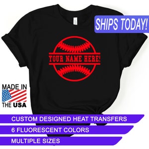 May include: Black t-shirt with a red baseball graphic and the text "YOUR NAME HERE!" printed on it. The shirt is made in the USA and is available in multiple sizes and 6 fluorescent colors.