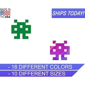 May include: Green and purple pixelated alien space invader graphic designs. 18 different colors and 10 different sizes.