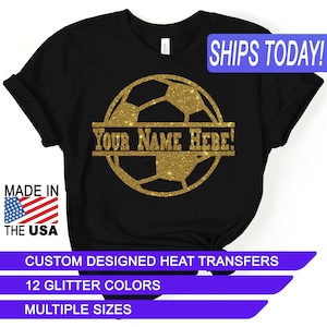 May include: Black t-shirt with a gold glitter soccer ball design. The soccer ball has a banner that says "YOUR NAME HERE!"  The shirt is available in multiple sizes and 12 glitter colors.