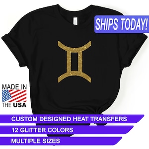 May include: Black t-shirt with a gold glitter Gemini zodiac sign. The text "SHIPS TODAY!" is in a blue box at the top of the image. The text "MADE IN THE USA" is in a red, white, and blue box at the bottom left of the image. The text "CUSTOM DESIGNED HEAT TRANSFERS" is in a white box at the bottom of the image. The text "12 GLITTER COLORS" is in a white box below the previous text. The text "MULTIPLE SIZES" is in a white box below the previous text.