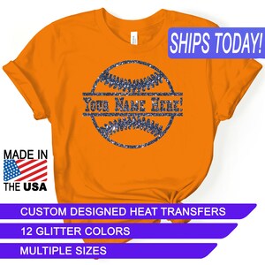 May include: Orange t-shirt with a glittery blue baseball design and the text "YOUR NAME HERE!"  Custom designed heat transfers. 12 glitter colors. Multiple sizes.