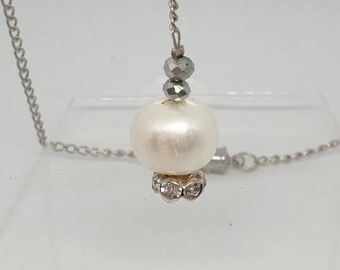 One of a kind necklace is made with a Fresh Water Pearl on a Stainless steel chain and a magnetic clasp.