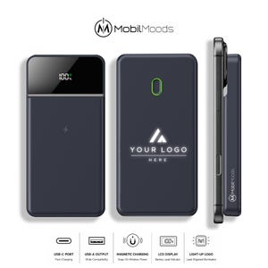 May include: A dark grey magnetic power bank with a digital LCD battery percentage display, a wireless charging surface, and a light-up logo area. The device features a USB-C port, a USB-A output, and is shown attached to a smartphone in a side profile view.