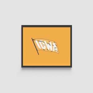 May include: A framed print featuring a stylized flag with the word "IOWA" in white against a yellow background. The flag is waving on a black pole, and the frame is black. The artwork is displayed on a white wall.