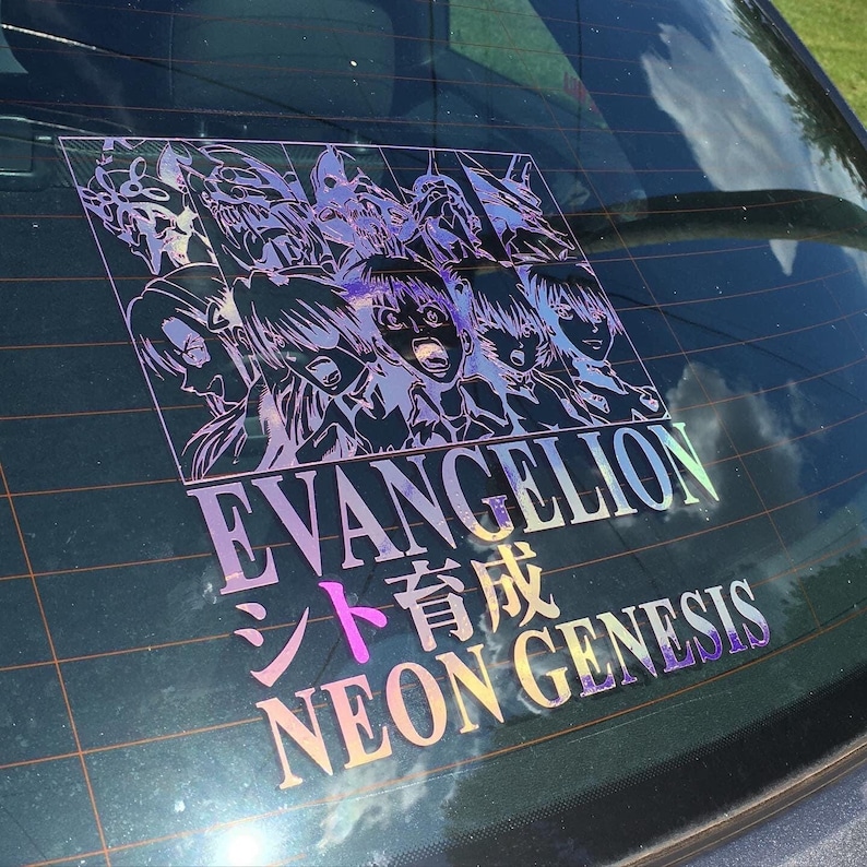 May include: A holographic sticker featuring a group of anime characters from the show Neon Genesis Evangelion. The sticker is on a car window and includes the text "EVANGELION" and "NEON GENESIS" in Japanese and English.