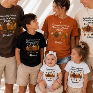 May include: A collection of t-shirts and a baby bodysuit in various colours, each featuring the text "Thanksgiving Cousin Crew 2026" above a graphic of cartoon food characters and a personalised name, worn by a group of six individuals.