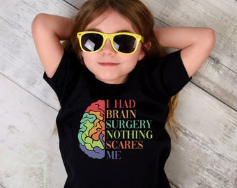 May include: A black t-shirt with a rainbow brain graphic and the text "I had brain surgery nothing scares me".