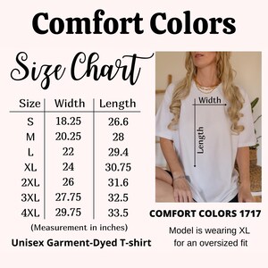 May include: Size chart for a unisex garment-dyed t-shirt. The chart shows the width and length measurements in inches for sizes S through 4XL. The model is wearing a size XL t-shirt for an oversized fit.