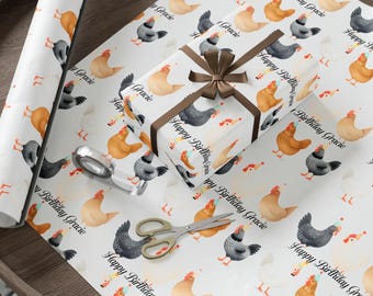 May include: White wrapping paper with a repeating pattern of chickens in various colors, some wearing party hats. A wrapped gift with a brown ribbon and the text "Happy Birthday Gracie" is visible, along with scissors and tape.
