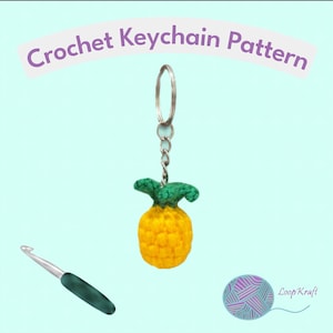 May include: A crochet pineapple keychain with a yellow body and green top attached to a silver metal ring and chain. A silver crochet hook with a dark green handle is positioned below. The text Crochet Keychain Pattern is at the top.