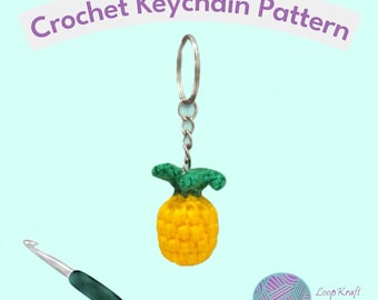 May include: A crochet pineapple keychain with a yellow body and green top attached to a silver metal ring and chain. A silver crochet hook with a dark green handle is positioned below. The text Crochet Keychain Pattern is at the top.