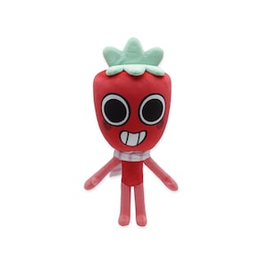 May include: A plush toy shaped like a red strawberry with a green leafy crown. It has large black eyes, a smiling mouth, and a small scarf. The arms and legs are pink.