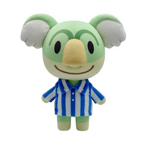 May include: Green and yellow koala plush toy wearing a blue and white striped shirt.