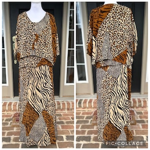 May include: A two-piece set consisting of a short-sleeved button-down top and a long skirt, both featuring a patchwork design of brown, black, and tan animal prints including leopard spots, tiger stripes, and zebra patterns in a coordinated style.