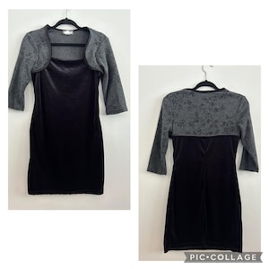 May include: A black velvet dress with a gray floral lace overlay. The dress has a scoop neck and three-quarter sleeves.
