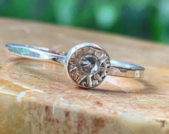 Gorgeous hammered silver ring with seedpod setting. Made with lab-created gemstones. Vegan organic rustic design.  One of a kind jewellery.