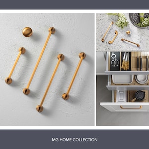 May include: A set of gold cabinet hardware, including pulls and knobs, shown on a white background. The hardware is arranged in a decorative pattern. The image also shows a kitchen cabinet with drawers and shelves, with the hardware installed.