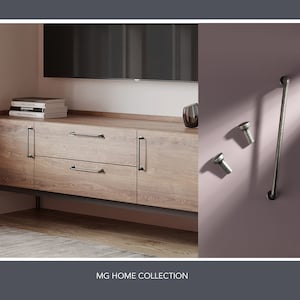 May include: Two drawers with black metal handles on a wooden cabinet. The cabinet is mounted on a wall and has a light wood finish. The cabinet is part of the MG Home Collection.