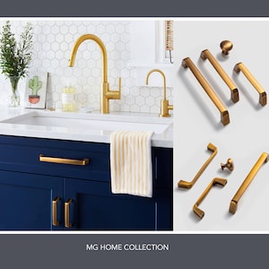 May include: A set of gold cabinet hardware, including knobs and pulls, with a brushed finish. The hardware is shown against a white background. MG Home Collection.