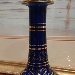 Vintage Victorian style Cobalt blue glass vase with White Cased glass and Gold Flowers Pattern. Circa 1900-1930.