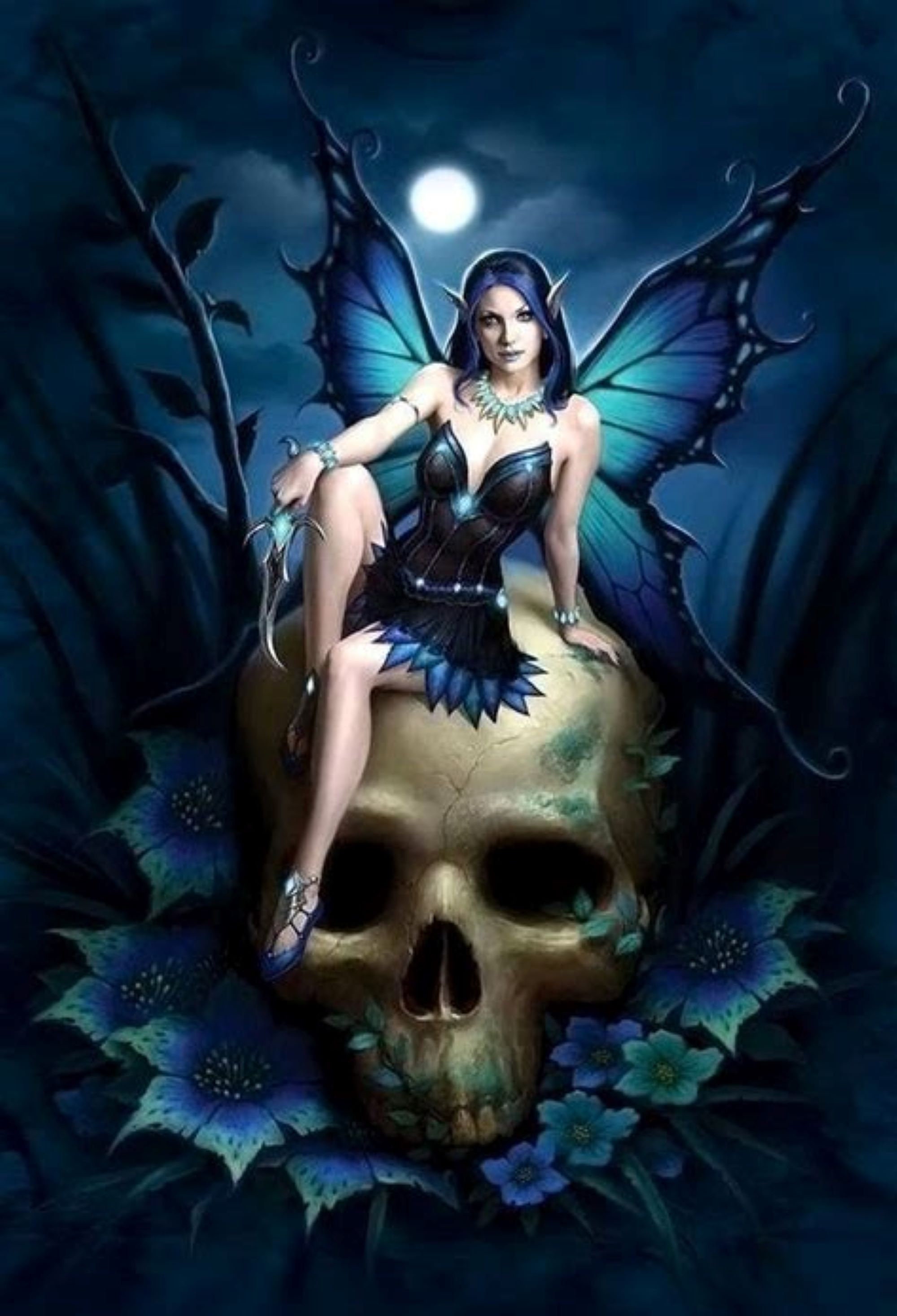 Discover T-shirt with Blue dressed Gothic Fairy sitting on skull for women and girls