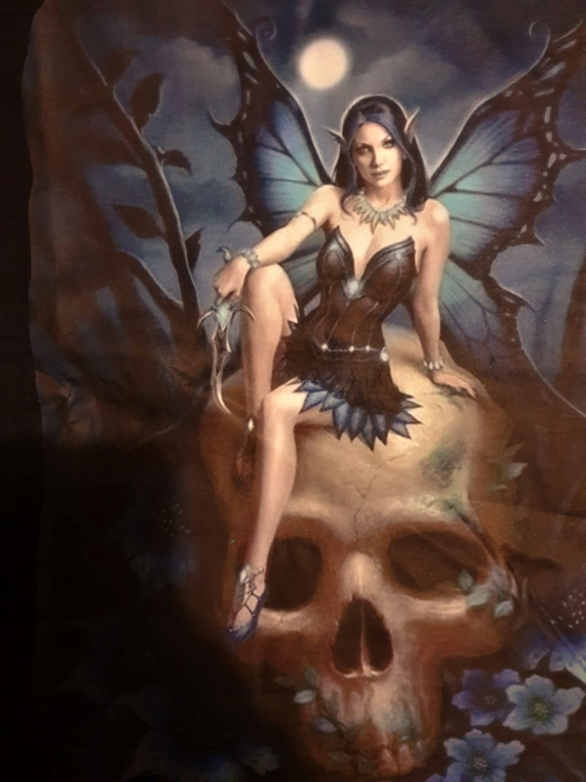 Discover T-shirt with Blue dressed Gothic Fairy sitting on skull for women and girls