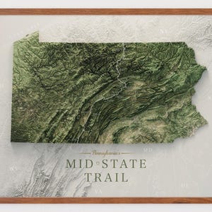 May include: A framed topographic map of Pennsylvania featuring the Mid State Trail. The map displays detailed green terrain, mountain ridges, and valleys. The text reads: Pennsylvania's MID STATE TRAIL. The surrounding states are labeled with abbreviations like OH, NY, NJ, MD, DE, VA, and WV.