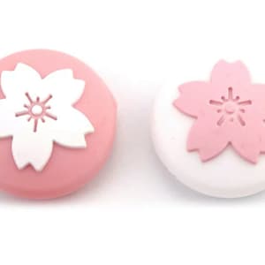 Sakura Flower Thumb Grips: Pink & White Silicone Joystick Caps