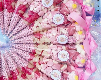 May include: Pink and white candy cones with a pink ribbon and a sticker that says "Hope you had fun Love Bethany".