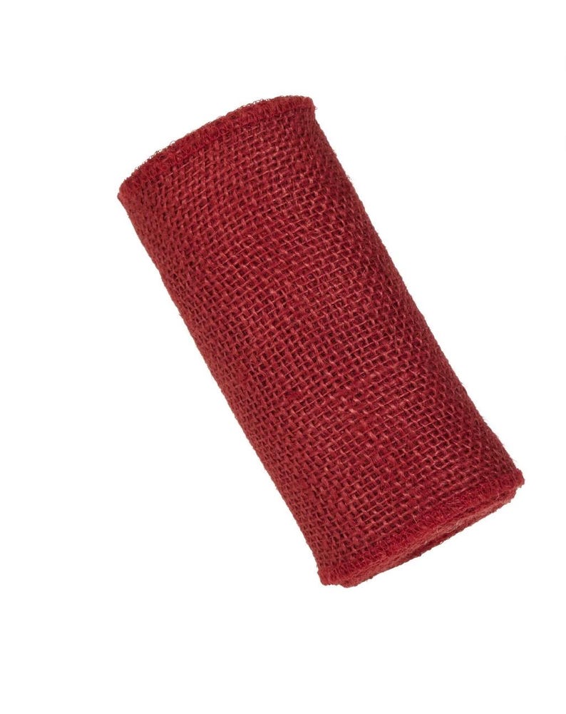 May include: A roll of red hessian ribbon. The ribbon is made of a coarse, woven fabric and has a rustic look.