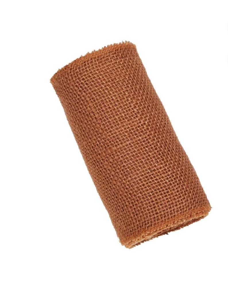 May include: A roll of brown hessian ribbon. The ribbon is woven and has a rough texture.