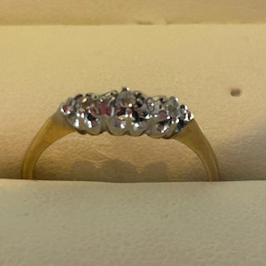 Art deco gold and platinum three stone diamond ring